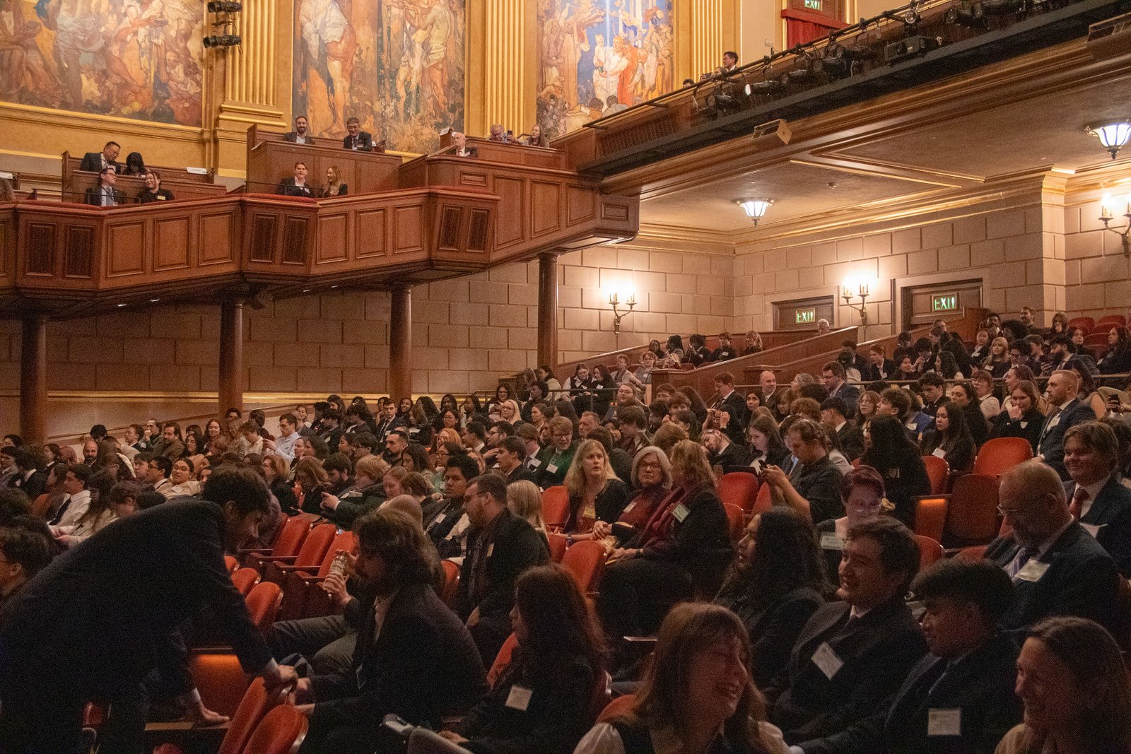 Delegates filling a historic assembly hall at the opening ceremony